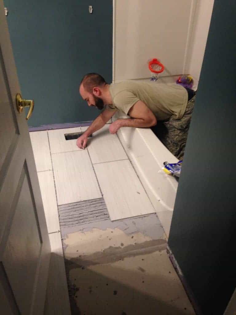 how to lay down tile in a bathroom 