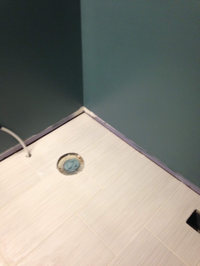 How to lay tile around bathroom toilet