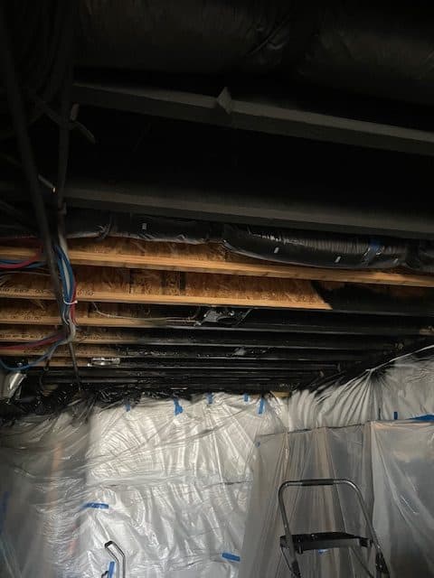 black ceilings hide wires and pipes